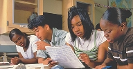 Photograph of students studying about rocks