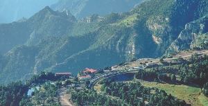 Photograph of a train traveling through a mountainous area