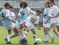 Photograph of opposing teams playing a game of soccer