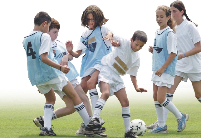 Photograph of opposing teams playing a game of soccer