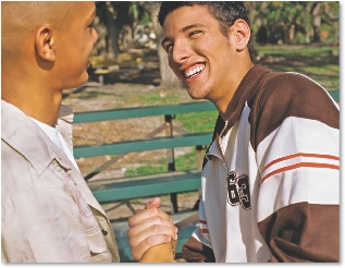 Photograph of two male teens shaking hands