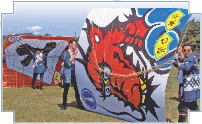 This team waits for its turn to fly their kite.