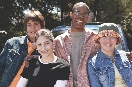 Photograph of a group of teens of different genders and ethnic origins