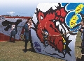 Photograph of several people with large kites before launch