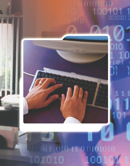 close-up photograph of a man's hands typing on a computer keyboard