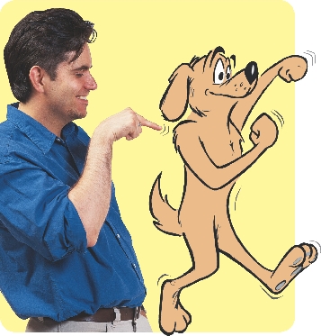 photograph of a man pointing to a cartoon illustration of a dog