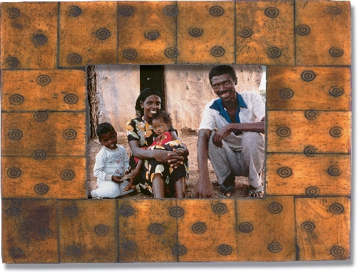 photograph of an African family, mother, father, young boy, and little girl