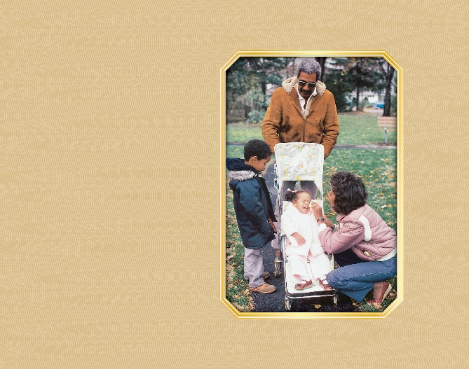 photograph of a family in a park, a young child is in a stroller and crying