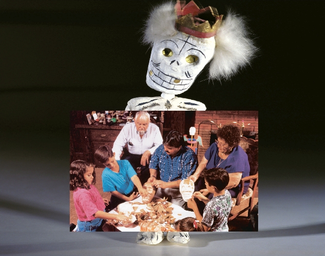 photograph of a family working together to make celebratory masks