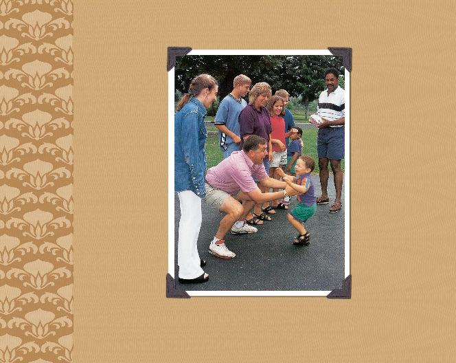 photograph of a family playing together in a park