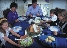 photograph of a family seated at a dinner table