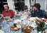 photograph of a family seated at a dinner table