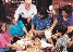 photograph of a family making celebratory masks