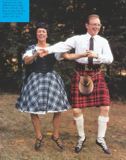 photograph of man and woman folk dancing in traditional Scottish dress