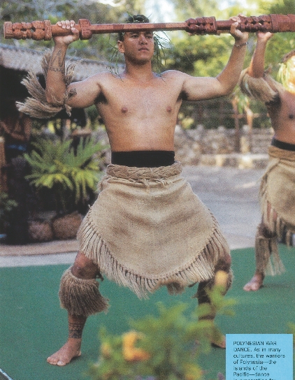 photograph of a Polynesian man in traditional dress doing a war dance