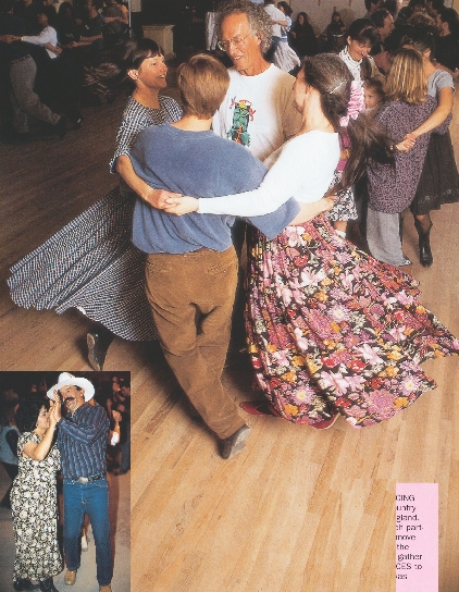 photograph of a group of people doing a country dance on a dance floor