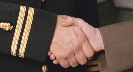 Photograph of a close up of a handshake.