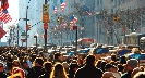 Photgraph of a crowded New York City street with throngs of people.
