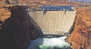 Photograph of a huge concrete dam holding back the river behind it