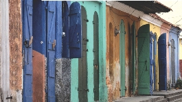 Photograph of small Caribbean homes in disrepair