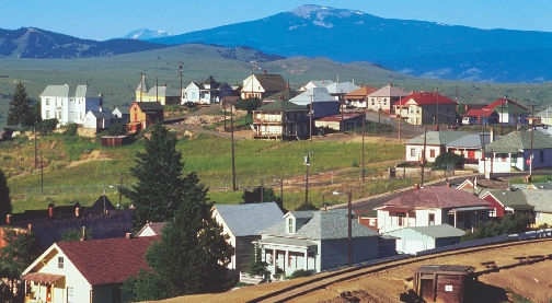 Photograph of a US town near the mountains with pine trees