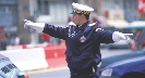 Photograph of a police officer directing traffic