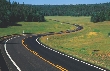 Photograph of a winding highway far ahead