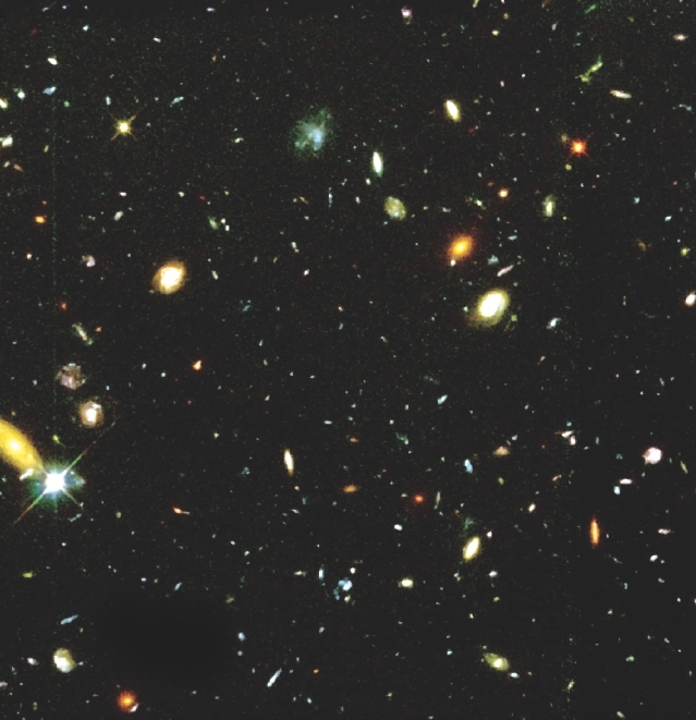 A telescope in space took this photo of the universe. It shows galaxies stretching out over billions of light-years.