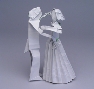 Lang makes a figure of two dancers from two rectangular sheets of paper.
