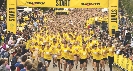 Photograph of many people running in a race