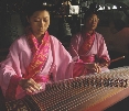 Musicians demonstrate how to play a traditional musical instrument in China.