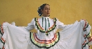 Photograph of a woman in a costume (white dress)