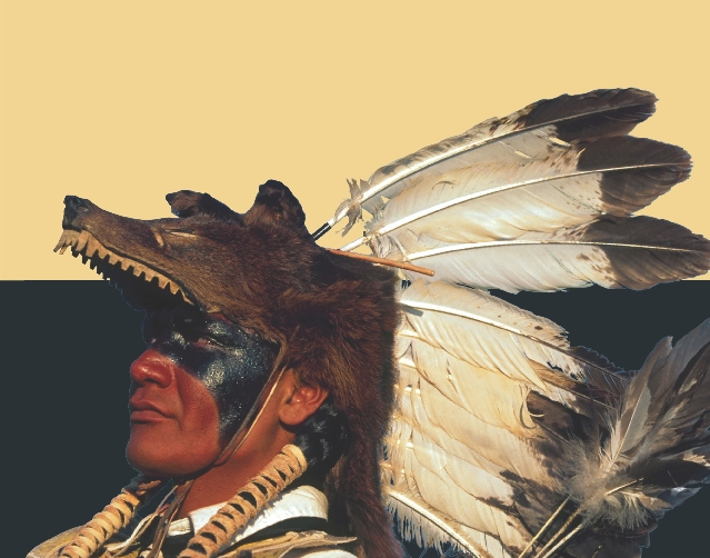 A Northern Arapaho man wears a wolf headdress and face paint. He is ready for a powwow, or gathering.