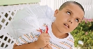 Photograph of a young boy rolling his eyes as he takes out the garbage