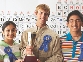 Photograph of students wearing the ribbons they won at a science fair